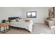 Bedroom featuring modern decor, a large window, and comfortable furnishings at 1727 Lowell Blvd, Denver, CO 80204