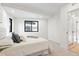 Bright bedroom with large window, plush carpet, and modern decor at 1727 Lowell Blvd, Denver, CO 80204