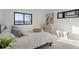 Bedroom featuring a view of the water through a large window and cozy decor at 1727 Lowell Blvd, Denver, CO 80204