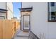 Inviting modern front door, complete with welcome mat, and stylish design at 1727 Lowell Blvd, Denver, CO 80204