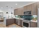 Sleek kitchen featuring modern appliances, ample counter space, and an open layout design at 1727 Lowell Blvd, Denver, CO 80204