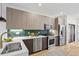Modern kitchen boasts stainless steel appliances, stylish backsplash, and an open layout at 1727 Lowell Blvd, Denver, CO 80204
