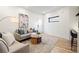 Bright and airy living room features modern decor, hardwood floors and comfortable seating at 1727 Lowell Blvd, Denver, CO 80204
