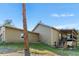 Beautiful backyard view with porch, stairs and an outdoor kitchen at 11044 Conestoga Pl, Franktown, CO 80116