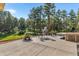 Spacious backyard patio featuring outdoor kitchen, dining and entertaining space at 11044 Conestoga Pl, Franktown, CO 80116