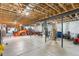 Unfinished basement featuring high ceilings, open layout and tractor at 11044 Conestoga Pl, Franktown, CO 80116