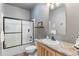 Bathroom featuring a vanity, toilet, and shower over tub with sliding doors at 11044 Conestoga Pl, Franktown, CO 80116