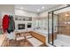 Modern bathroom with a soaking tub, fireplace, and walk-in shower at 11044 Conestoga Pl, Franktown, CO 80116