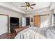 Main bedroom with a wooden bed and bright natural light at 11044 Conestoga Pl, Franktown, CO 80116