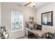Office with a desk and bright natural light at 11044 Conestoga Pl, Franktown, CO 80116