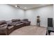 Home theater room complete with reclining leather seating, projector, and popcorn machine at 11044 Conestoga Pl, Franktown, CO 80116