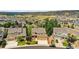 Spacious home on a large lot with a well-manicured lawn and landscaping in a quiet, suburban neighborhood at 1997 Fox Haven Dr, Castle Rock, CO 80104
