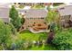 Aerial view showcasing the property's expansive backyard, well-maintained lawn, and inviting deck for outdoor enjoyment at 1997 Fox Haven Dr, Castle Rock, CO 80104