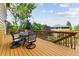 Enjoy outdoor dining on the expansive back deck overlooking the landscaped backyard and lush greenery at 1997 Fox Haven Dr, Castle Rock, CO 80104