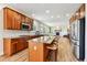 Well-designed kitchen with a large island, modern appliances, wood cabinets, and an open layout great for entertaining at 1997 Fox Haven Dr, Castle Rock, CO 80104