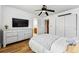 Bright main bedroom features a ceiling fan, closet, and an ensuite bathroom for added convenience at 1997 Fox Haven Dr, Castle Rock, CO 80104