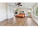 Bright main bedroom featuring an open floor plan, stone fireplace and natural light at 1997 Fox Haven Dr, Castle Rock, CO 80104