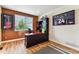 Home office with dark wood desk and sports memorabilia on display at 1997 Fox Haven Dr, Castle Rock, CO 80104