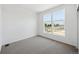Bright bedroom featuring plush carpeting and large windows offering lots of natural light at 1224 Penner Dr, Erie, CO 80026