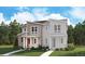Charming two-story home with a combination of stone, siding and decorative brick, set against a backdrop of lush greenery at 1224 Penner Dr, Erie, CO 80026