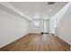 Bright living room featuring hardwood floors, large window and white walls at 1224 Penner Dr, Erie, CO 80026