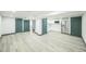 Finished basement with a kitchenette, stainless steel appliances, and ample open space at 7810 Larkwood St, Commerce City, CO 80022