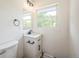 Bright bathroom with white vanity, black fixtures, and a window offering natural light at 7810 Larkwood St, Commerce City, CO 80022