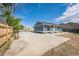 Home exterior showing a long concrete driveway at 7810 Larkwood St, Commerce City, CO 80022