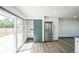 Contemporary kitchen with a sliding door with convenient stainless steel refrigerator at 7810 Larkwood St, Commerce City, CO 80022