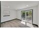 Bright, large open room with sliding glass door to backyard patio at 7810 Larkwood St, Commerce City, CO 80022