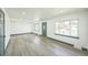 Spacious living room with large windows providing ample natural light at 7810 Larkwood St, Commerce City, CO 80022
