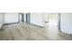 Bright and airy living room featuring sleek floors and modern finishes at 7810 Larkwood St, Commerce City, CO 80022