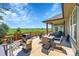 Outdoor patio with a stainless steel grill, dining table and views of the green pastures at 6670 Club Villa Rd, Parker, CO 80134
