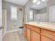 Well-lit bathroom with a single vanity, a shower, and tiled floors at 6670 Club Villa Rd, Parker, CO 80134