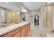 Luxurious bathroom with dual vanities, walk-in shower, and a soaking tub at 6670 Club Villa Rd, Parker, CO 80134