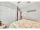 Bedroom with a ceiling fan, double closets, and door to what appears to be another bedroom at 6670 Club Villa Rd, Parker, CO 80134