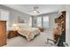 Serene bedroom with a ceiling fan, natural light, and comfortable furnishings at 6670 Club Villa Rd, Parker, CO 80134