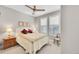 Cozy bedroom with natural light, ceiling fan, neutral walls and a charming bedspread at 6670 Club Villa Rd, Parker, CO 80134
