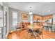 Cozy dining area with hardwood floors, adjacent to a well-equipped kitchen at 6670 Club Villa Rd, Parker, CO 80134