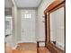 Bright entryway features a coat rack with a mirror, adding functionality and style at 6670 Club Villa Rd, Parker, CO 80134
