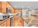 Spacious kitchen features granite countertops, stainless steel appliances, and ample cabinet space at 6670 Club Villa Rd, Parker, CO 80134