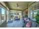Bright sunroom with comfortable seating and lots of natural light and views of the landscape at 6670 Club Villa Rd, Parker, CO 80134