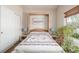 Bedroom with a window, closet and a murphy bed at 19407 E Radcliff Pl, Aurora, CO 80015
