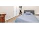 Bedroom featuring carpet, neutral walls, a bed, and doorway to another room at 19407 E Radcliff Pl, Aurora, CO 80015