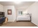 Cozy bedroom featuring carpet, neutral walls, a window and a comfortable full bed at 19407 E Radcliff Pl, Aurora, CO 80015