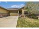 Charming ranch home with a well-maintained lawn, beautiful flowering tree, and two car garage at 19407 E Radcliff Pl, Aurora, CO 80015