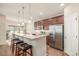This kitchen has stainless steel appliances, granite countertops, breakfast bar, and plenty of cabinet space at 19407 E Radcliff Pl, Aurora, CO 80015