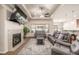 Spacious living room with modern fireplace, large television, and comfortable seating arrangement at 19407 E Radcliff Pl, Aurora, CO 80015