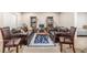 Cozy living room with an area rug, couches, and bookcases at 19407 E Radcliff Pl, Aurora, CO 80015