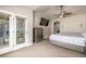 Carpeted main bedroom with a glass door leading to the outside at 19407 E Radcliff Pl, Aurora, CO 80015
